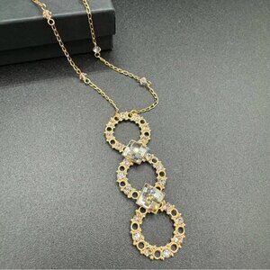 Belladonna Circular Crystal and Gold Tone Infinity Pendant Necklace